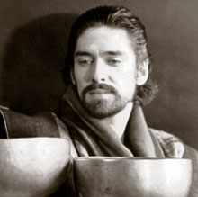 Rain Gray with two antique Master-quality Tibetan singing bowls.