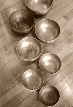 A matched chakra-tuned set of authentic antique Tibetan singing bowls.