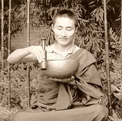 Lama Lobsang Molam playing a large antique Tibetan singing bowl